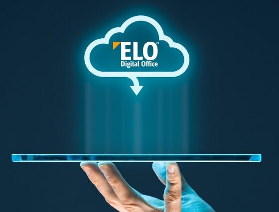 Hand holding a tablet with a holographic ELO Digital Office cloud logo