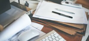 Documents on a table waiting to be scanned