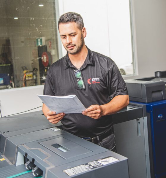 Man working on a refurbished printer