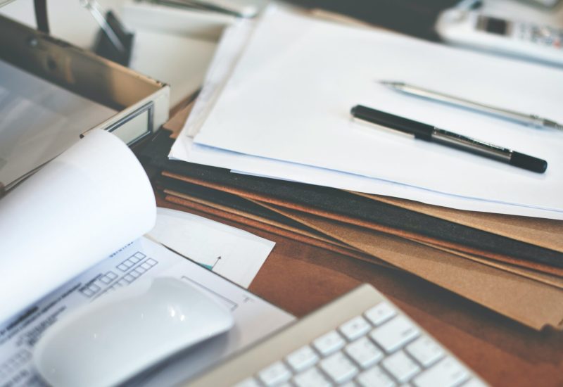 getty-images-klWprY_7zrk-unsplash Documents on a table waiting to be scanned
